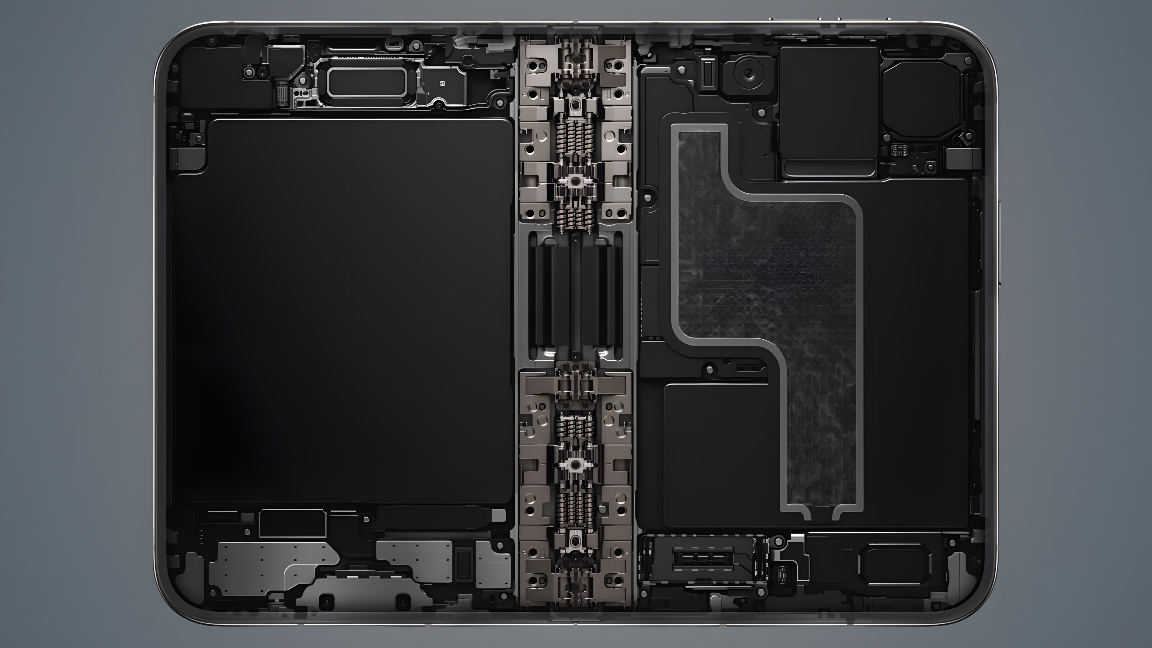 The internals of the iPhone Duo: two battery cells either side of the hinge assembly, logic board and speakers